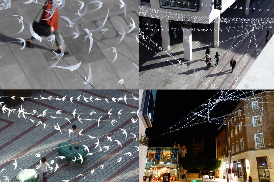 four images showing an installation of hand-made swifts above predestrian streets, by Naomi Hart