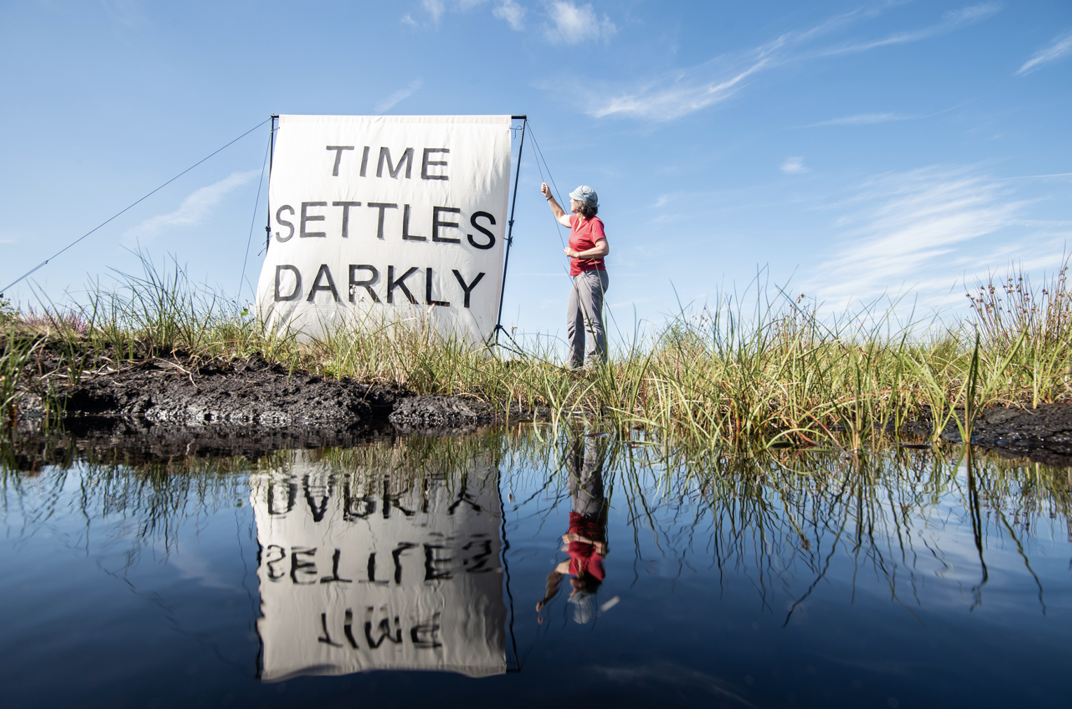 'Time Settles Darkly' Canvas installed on Bolton Fell Moss, with artist Harriet Fraser