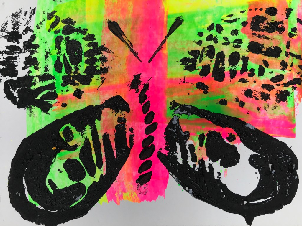 a child's bright collagraph print of a butterfly