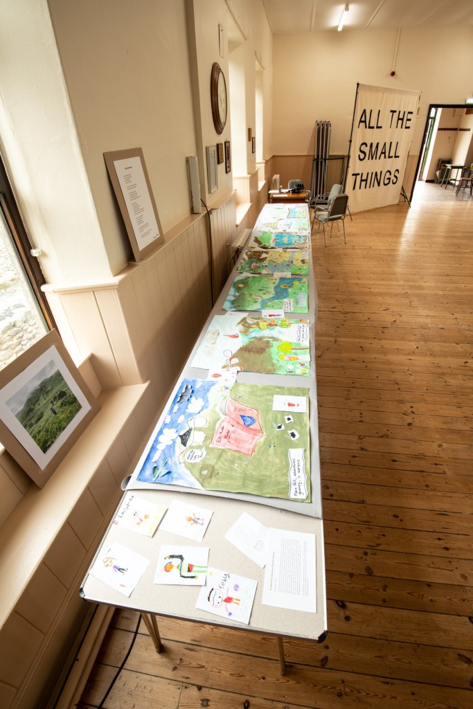 A photograph of a long drawing in an exhibition space